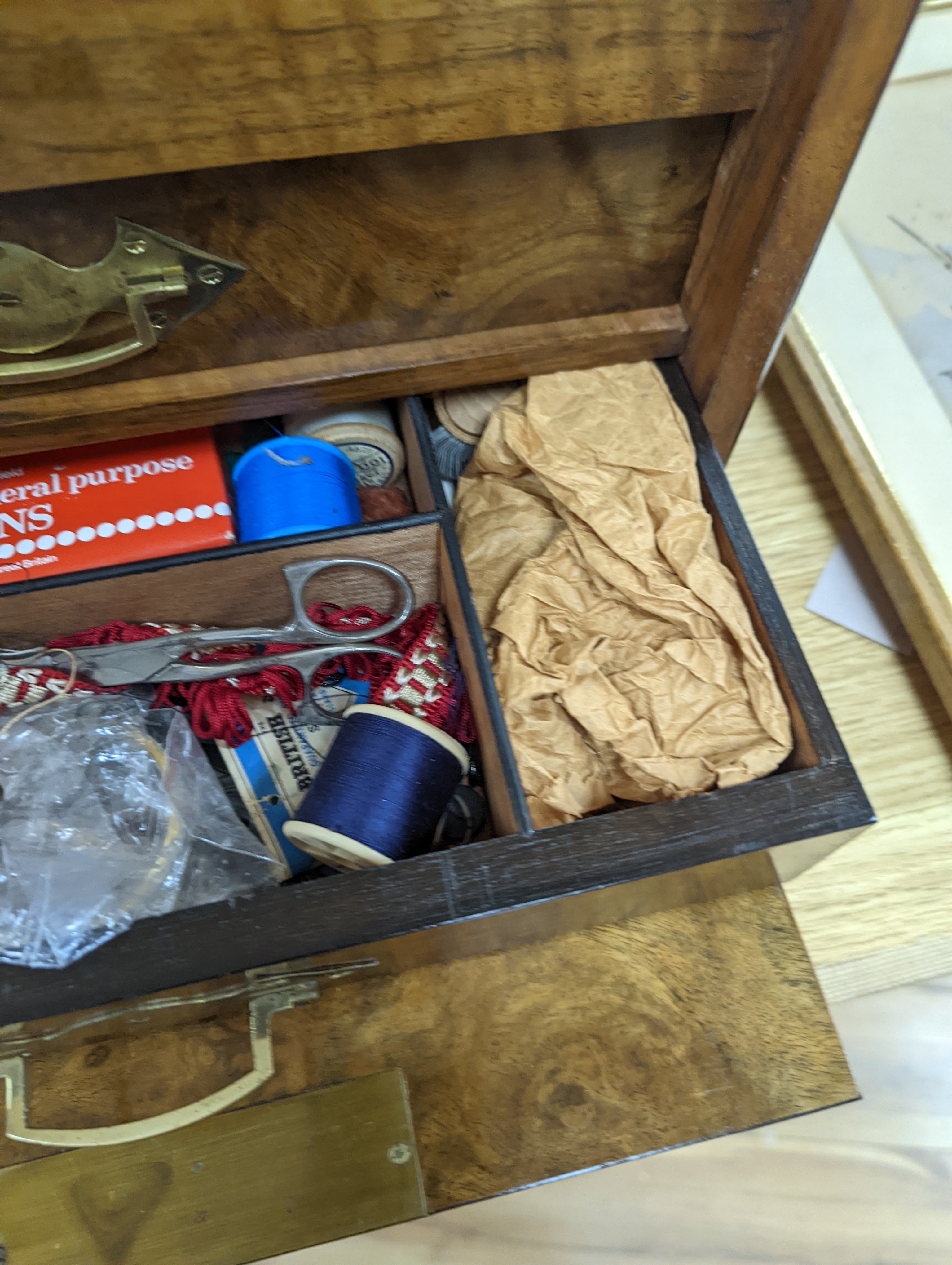 A Victorian walnut sewing casket, 34cm, containing sewing related accessories